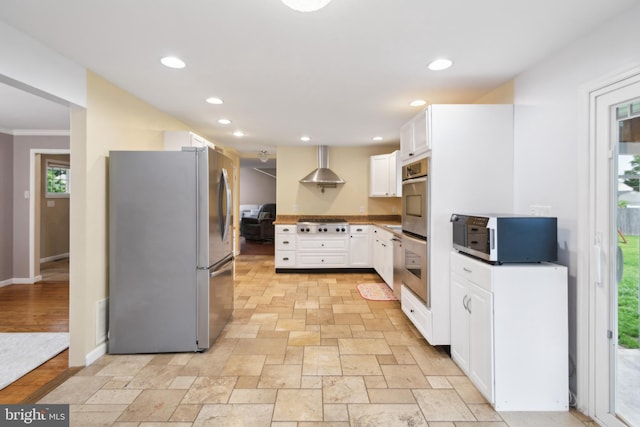 52 Marlborough Ave, Marlton, NJ 08053 - kitchen with stainless steel appliances, wall chimney exhaust hood, white cabinetry, recessed lighting, and light stone finish flooring