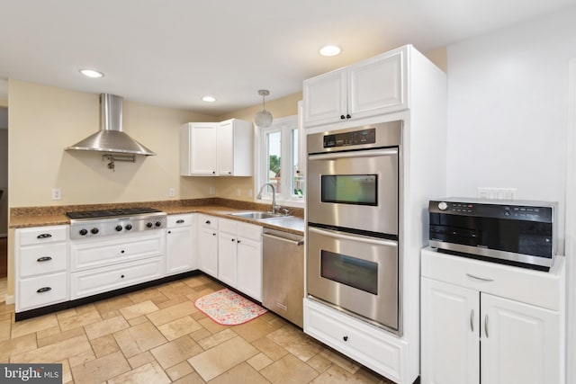 52 Marlborough Ave, Marlton, NJ 08053 - kitchen featuring wall chimney range hood, stainless steel appliances, a sink, white cabinets, and stone tile flooring