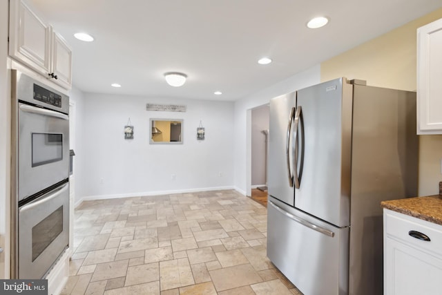 52 Marlborough Ave, Marlton, NJ 08053 - kitchen featuring stainless steel appliances, white cabinetry, light stone finish flooring, recessed lighting, and baseboards