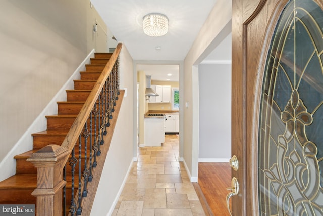 52 Marlborough Ave, Marlton, NJ 08053 - entryway with stone tile floors, stairs, baseboards, and a chandelier