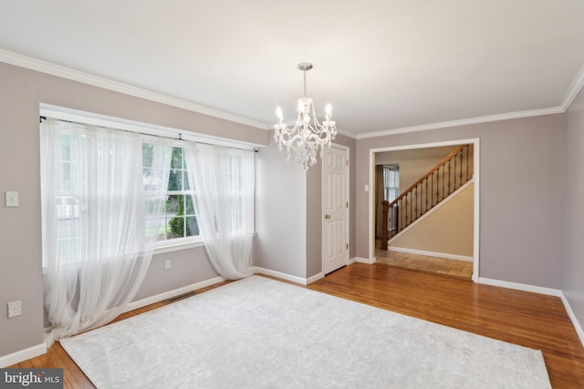 52 Marlborough Ave, Marlton, NJ 08053 - empty room featuring a chandelier, crown molding, wood finished floors, baseboards, and stairs