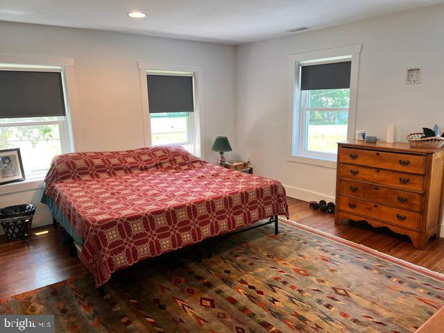 7299 Marshall St, Lincoln, DE 19960 - bedroom with multiple windows, wood finished floors, recessed lighting, and baseboards