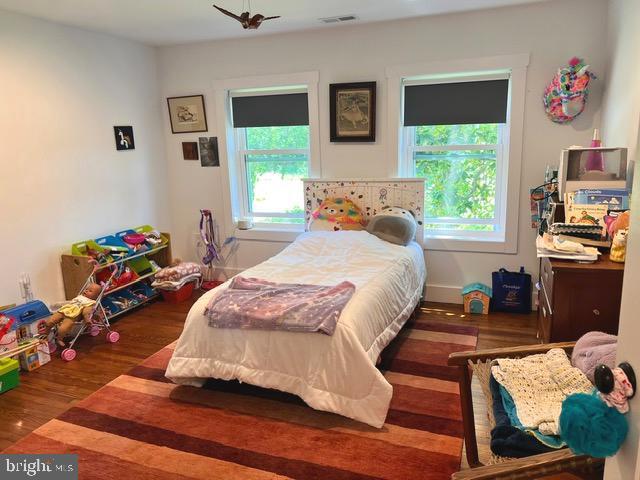 7299 Marshall St, Lincoln, DE 19960 - bedroom with multiple windows and wood finished floors