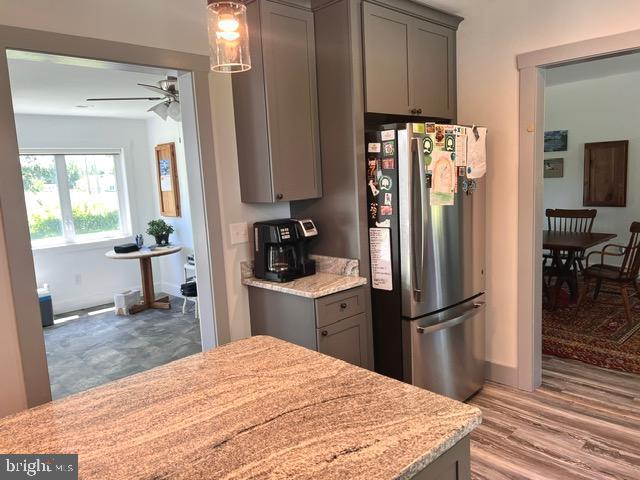 7299 Marshall St, Lincoln, DE 19960 - kitchen featuring freestanding refrigerator, gray cabinets, and a ceiling fan