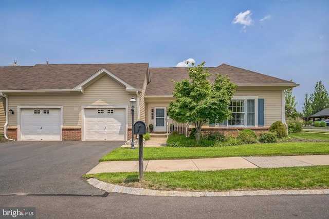 1 Hedge Row Rd, Princeton, NJ 08540 - view of front of property with brick siding, asphalt driveway, a garage, and roof with shingles