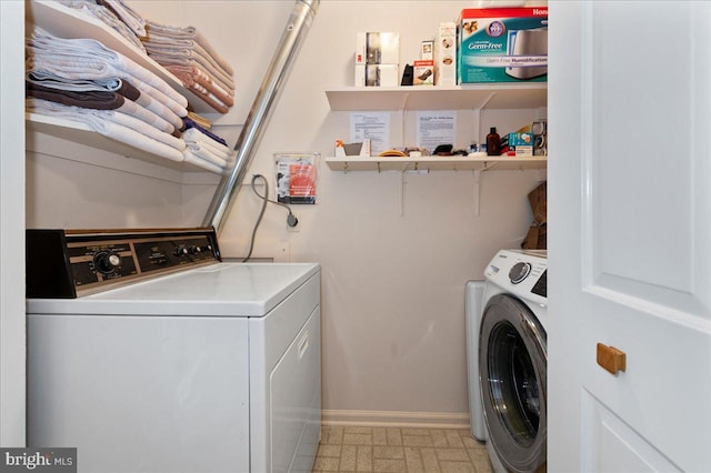 14 Providence Ave, Doylestown, PA 18901 - washroom with baseboards and washer and clothes dryer