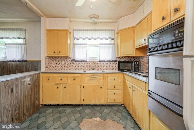 1103 Laurel Rd, Edgewater Park, NJ 08010 - kitchen with stainless steel oven, a warming drawer, plenty of natural light, and light countertops
