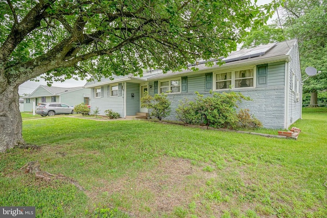 1103 Laurel Rd, Edgewater Park, NJ 08010 - view of front of house with solar panels and a front yard