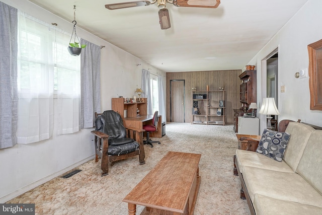 1103 Laurel Rd, Edgewater Park, NJ 08010 - living room with a ceiling fan, carpet, and wood walls