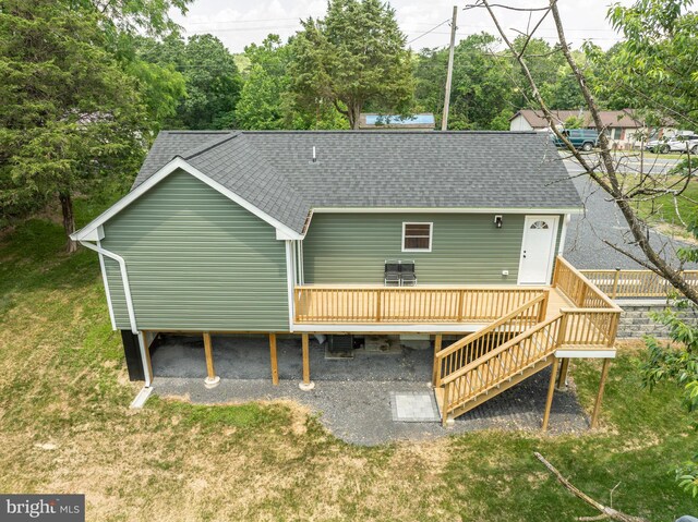 2968 Sulphur Springs Rd, Inwood, WV 25428 - rear view of house with roof with shingles, a deck, a lawn, and stairway