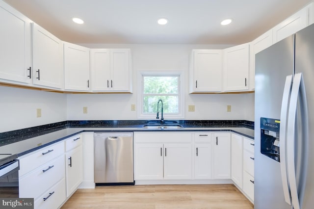 2968 Sulphur Springs Rd, Inwood, WV 25428 - kitchen with appliances with stainless steel finishes, white cabinets, recessed lighting, light wood-style flooring, and dark stone countertops
