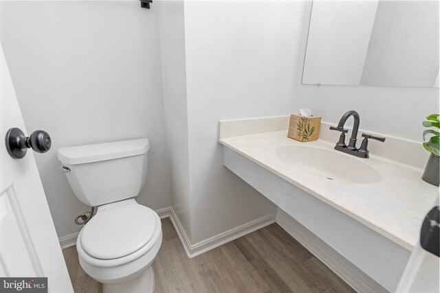 12307 Sandy Point Ct, Silver Spring, MD 20904 - half bath featuring wood finished floors and vanity