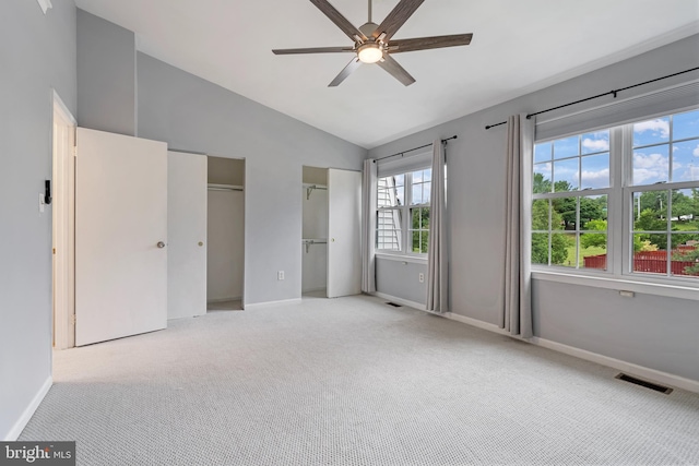 12307 Sandy Point Ct, Silver Spring, MD 20904 - unfurnished bedroom featuring carpet flooring, vaulted ceiling, multiple closets, and ceiling fan
