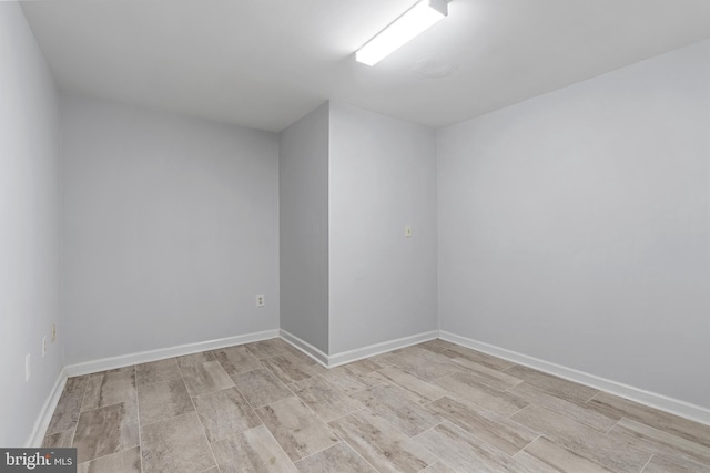 12307 Sandy Point Ct, Silver Spring, MD 20904 - empty room featuring baseboards and light wood-style floors