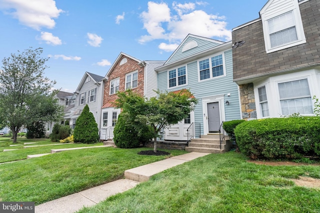 12307 Sandy Point Ct, Silver Spring, MD 20904 - view of property featuring a front yard, entry steps, a residential view, stone siding, and a shingled roof