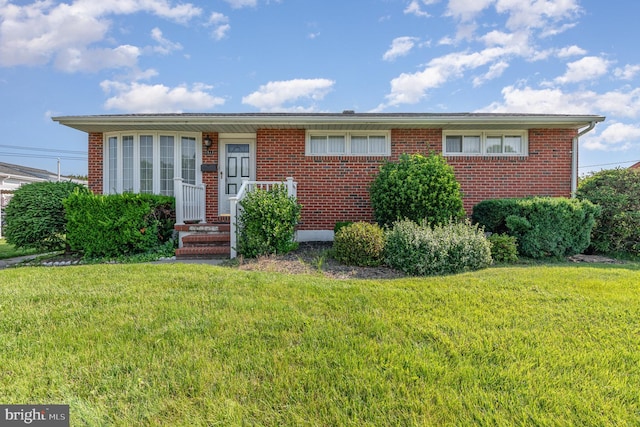 1513 Chapel Hill Dr, Baltimore, MD 21237 - view of front of house featuring a front yard and brick siding