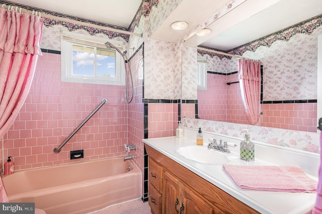 1513 Chapel Hill Dr, Baltimore, MD 21237 - bathroom featuring wallpapered walls, shower / tub combo with curtain, vanity, tile walls, and a wainscoted wall