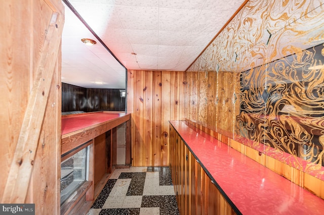 1513 Chapel Hill Dr, Baltimore, MD 21237 - indoor dry bar featuring tile patterned floors and wood walls