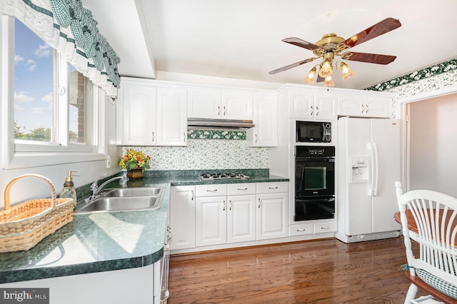 1513 Chapel Hill Dr, Baltimore, MD 21237 - kitchen with black appliances, a warming drawer, white cabinetry, and under cabinet range hood