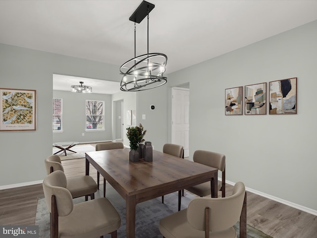 4300 Cullowhee Ct, Clinton, MD 20735 - dining room featuring a chandelier, wood finished floors, and baseboards