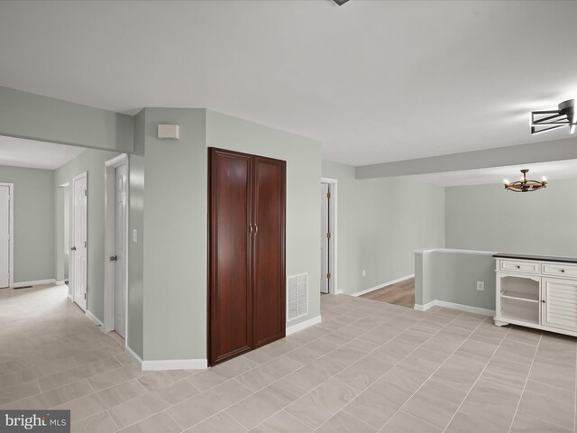 4300 Cullowhee Ct, Clinton, MD 20735 - corridor featuring a chandelier and baseboards