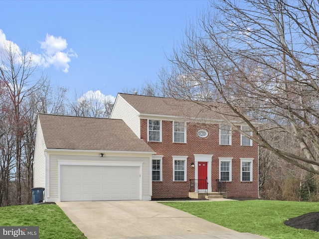 4300 Cullowhee Ct, Clinton, MD 20735 - colonial-style house with concrete driveway, an attached garage, a front lawn, a shingled roof, and brick siding