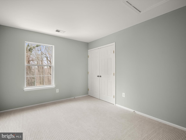 4300 Cullowhee Ct, Clinton, MD 20735 - unfurnished bedroom featuring light carpet, a closet, and baseboards
