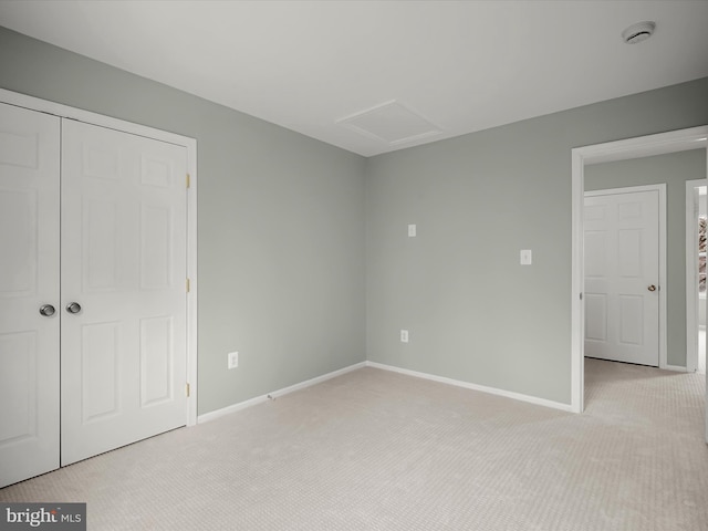 4300 Cullowhee Ct, Clinton, MD 20735 - unfurnished bedroom with attic access, light carpet, baseboards, and a closet