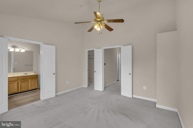 11476 Leland Pl, Waldorf, MD 20601 - unfurnished bedroom featuring light colored carpet, baseboards, high vaulted ceiling, ensuite bathroom, and a spacious closet