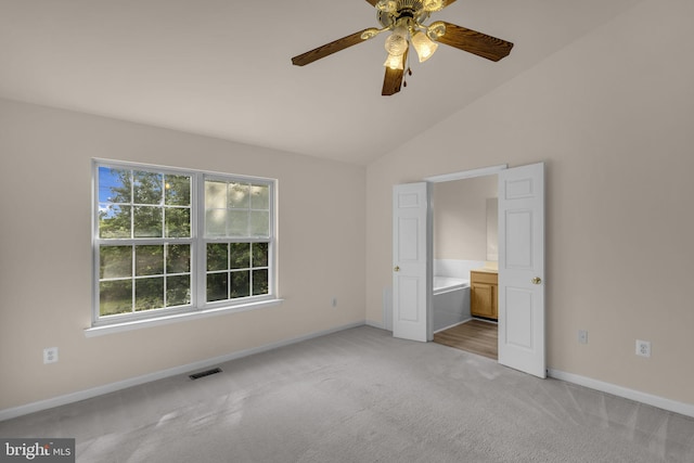 11476 Leland Pl, Waldorf, MD 20601 - unfurnished bedroom with light colored carpet, baseboards, vaulted ceiling, connected bathroom, and ceiling fan