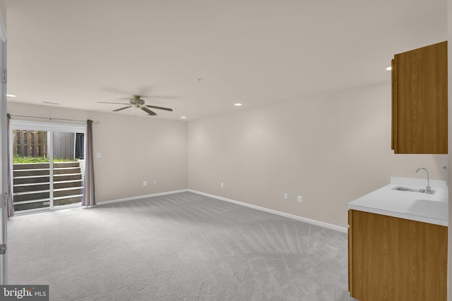 11476 Leland Pl, Waldorf, MD 20601 - unfurnished living room featuring a sink, light carpet, ceiling fan, baseboards, and recessed lighting