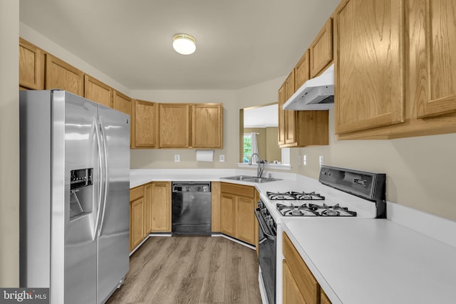 11476 Leland Pl, Waldorf, MD 20601 - kitchen featuring stainless steel fridge, gas range gas stove, a sink, under cabinet range hood, and black dishwasher