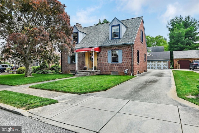 29 S Rockburn St, York, PA 17402 - view of front of house with brick siding, a front lawn, concrete driveway, and a chimney