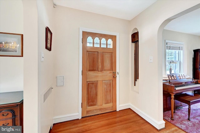 29 S Rockburn St, York, PA 17402 - entrance foyer with arched walkways, light wood-style floors, and baseboards