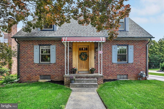 29 S Rockburn St, York, PA 17402 - bungalow-style home featuring brick siding, roof with shingles, and a front yard