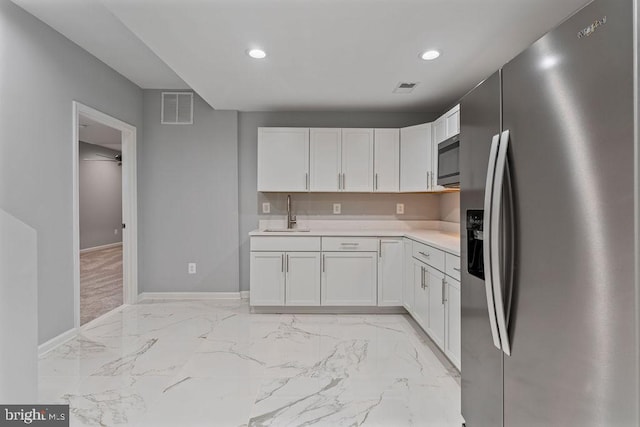417 Overlook Dr, Front Royal, VA 22630 - kitchen with appliances with stainless steel finishes, a sink, light countertops, white cabinets, and baseboards