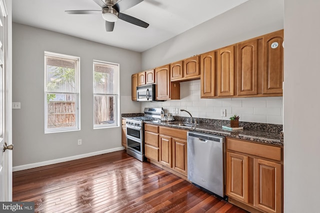 424 N Luzerne Ave N, Baltimore, MD 21224 - kitchen with stainless steel appliances, ceiling fan, tasteful backsplash, a sink, and baseboards