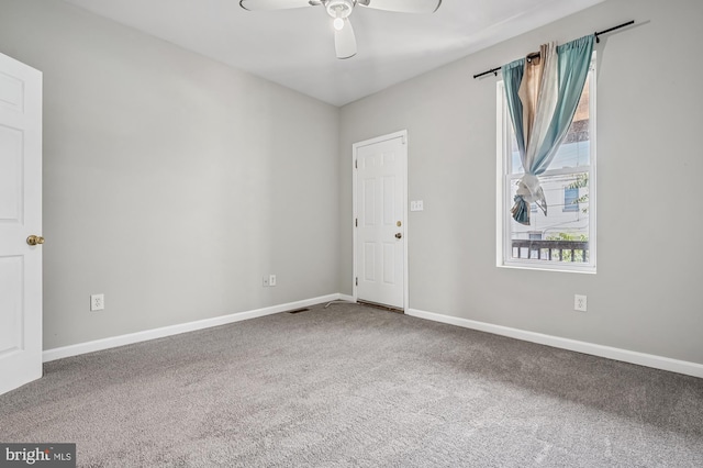424 N Luzerne Ave N, Baltimore, MD 21224 - unfurnished room with carpet floors, a ceiling fan, and baseboards