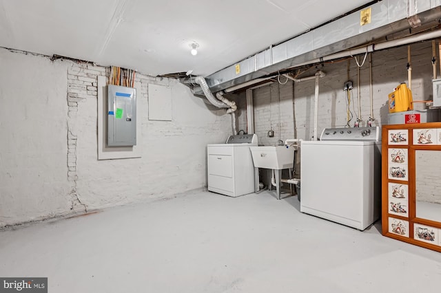 424 N Luzerne Ave N, Baltimore, MD 21224 - unfinished below grade area featuring electric panel, separate washer and dryer, and a sink