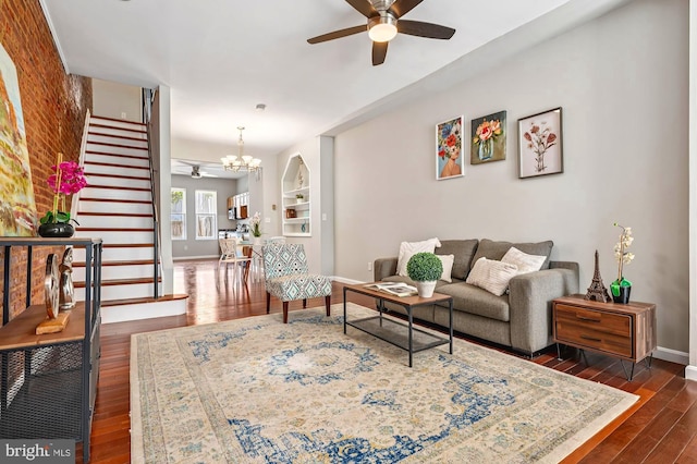 424 N Luzerne Ave N, Baltimore, MD 21224 - living area with a ceiling fan, stairway, baseboards, dark wood finished floors, and a chandelier