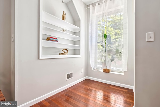 424 N Luzerne Ave N, Baltimore, MD 21224 - empty room with wood-type flooring and baseboards