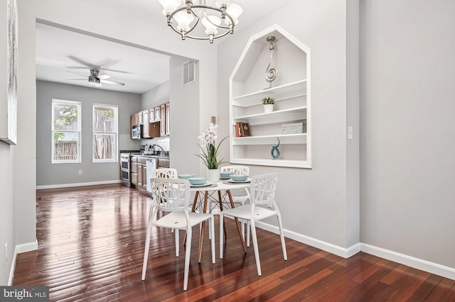 424 N Luzerne Ave N, Baltimore, MD 21224 - dining room with a chandelier, dark wood-style flooring, baseboards, and a ceiling fan