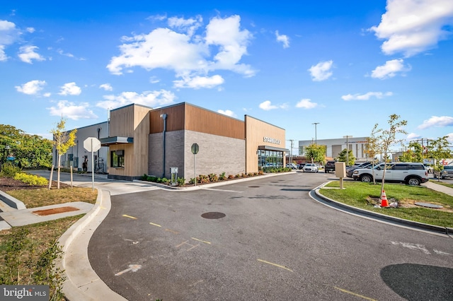 612 Mozart Way, Baltimore, MD 21224 - view of asphalt street with curbs and traffic signs