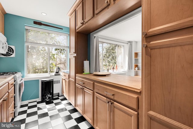 4100 W St NW Unit 314, Washington, DC 20007 - kitchen featuring dark floors, white range with gas stovetop, light countertops, and recessed lighting