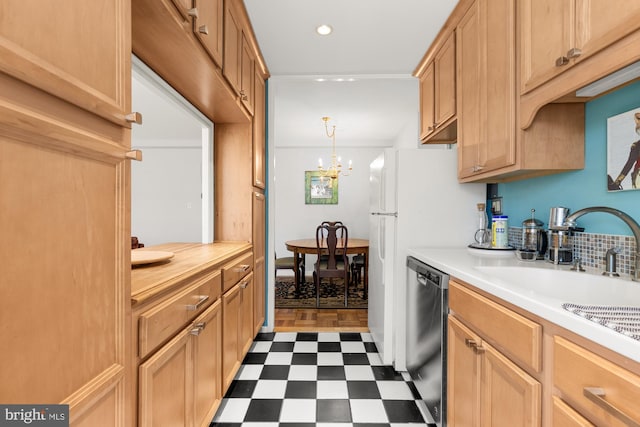 4100 W St NW Unit 314, Washington, DC 20007 - kitchen with dishwashing machine, dark floors, light countertops, recessed lighting, and a chandelier