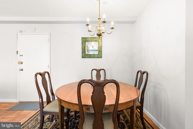 4100 W St NW Unit 314, Washington, DC 20007 - dining room with a chandelier and baseboards