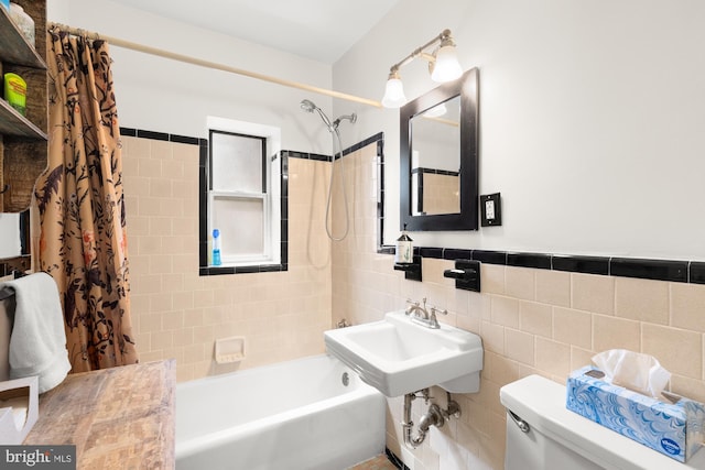 4100 W St NW Unit 314, Washington, DC 20007 - bathroom featuring shower / bath combo, toilet, and tile walls