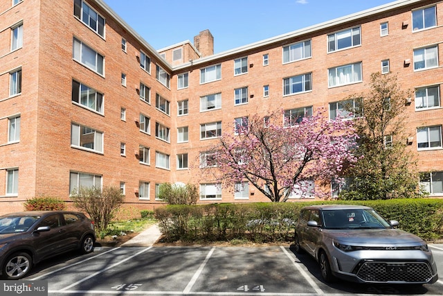 4100 W St NW Unit 314, Washington, DC 20007 - view of apartment building / complex featuring uncovered parking