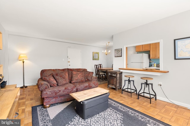 4100 W St NW Unit 314, Washington, DC 20007 - living room with baseboards and a chandelier