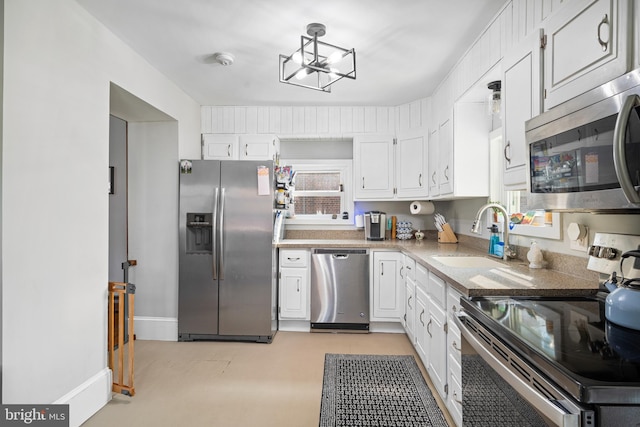 19 W Ave, Woodstown, NJ 08098 - kitchen featuring stainless steel appliances, a sink, white cabinets, and light countertops